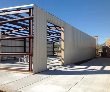 This is the North exposure with single bay door at east end and Man door at west end. This door will facilitate a two post lift and will be the only roll up door used.