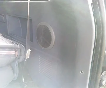 Passenger side cargo panel