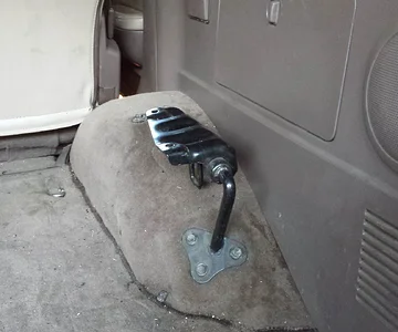Rear seat removed from bracket