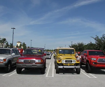 Land Cruisers and a Tacoma at Cars and Coffee