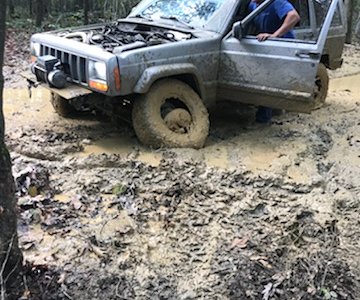3 tires flat out of mud hole