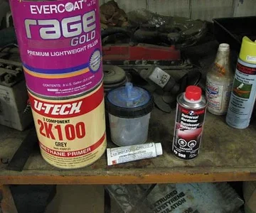 Some of the product used. The Evercoat Rage Gold filler was awesome. Easy to work with, mixed with 1/4 putty filler (didn't get a pic of it) and 1/8 hardener and went on like a dream. Sanded with 40 grit just after tackiness went away (approx 7-10 mins),