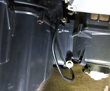 Upper and Lower Screws on Right-side of AC Housing Unit