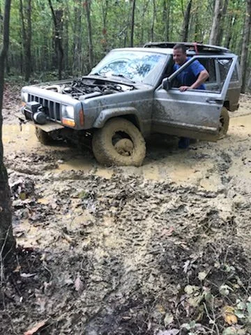 3 tires flat out of mud hole