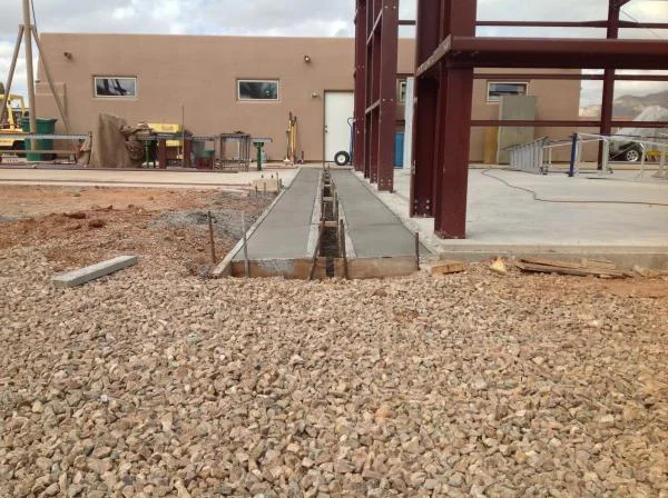 45' of trench drain system done. Phase VI of concrete to complete building is next. 17 more yards for drive/entry (west end). Total of 120 yards to complete building project.