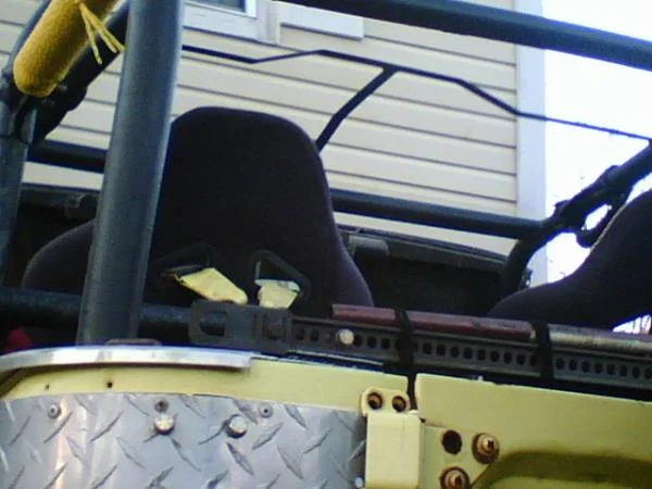 A little cage I bent up and welded into my cage to keep water from pooling in my soft top.