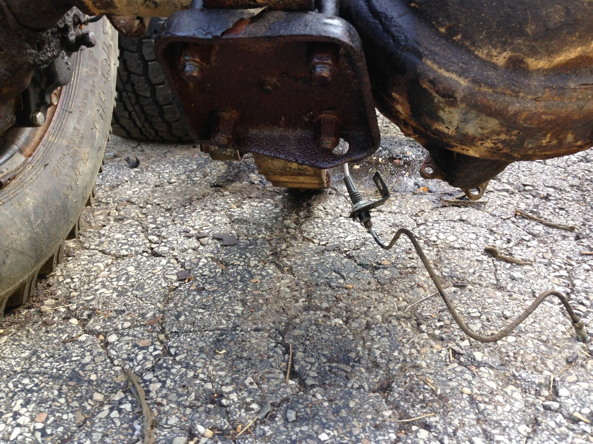 Axle and suspension removal rear drivers side leaf spring UBolt plate view 6