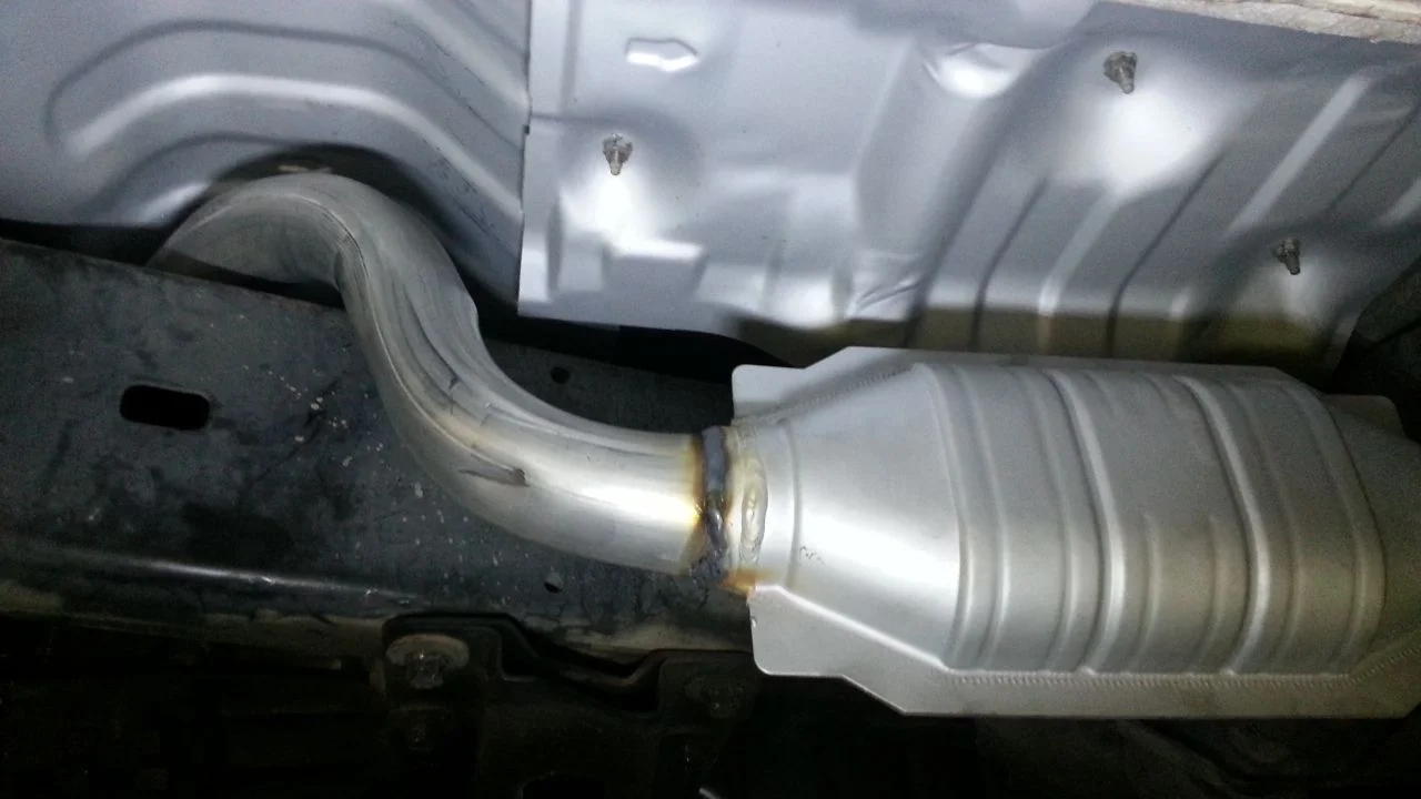 cat over framerail to muffler