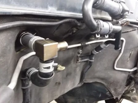 Custom coolant fitting to hook up heater system