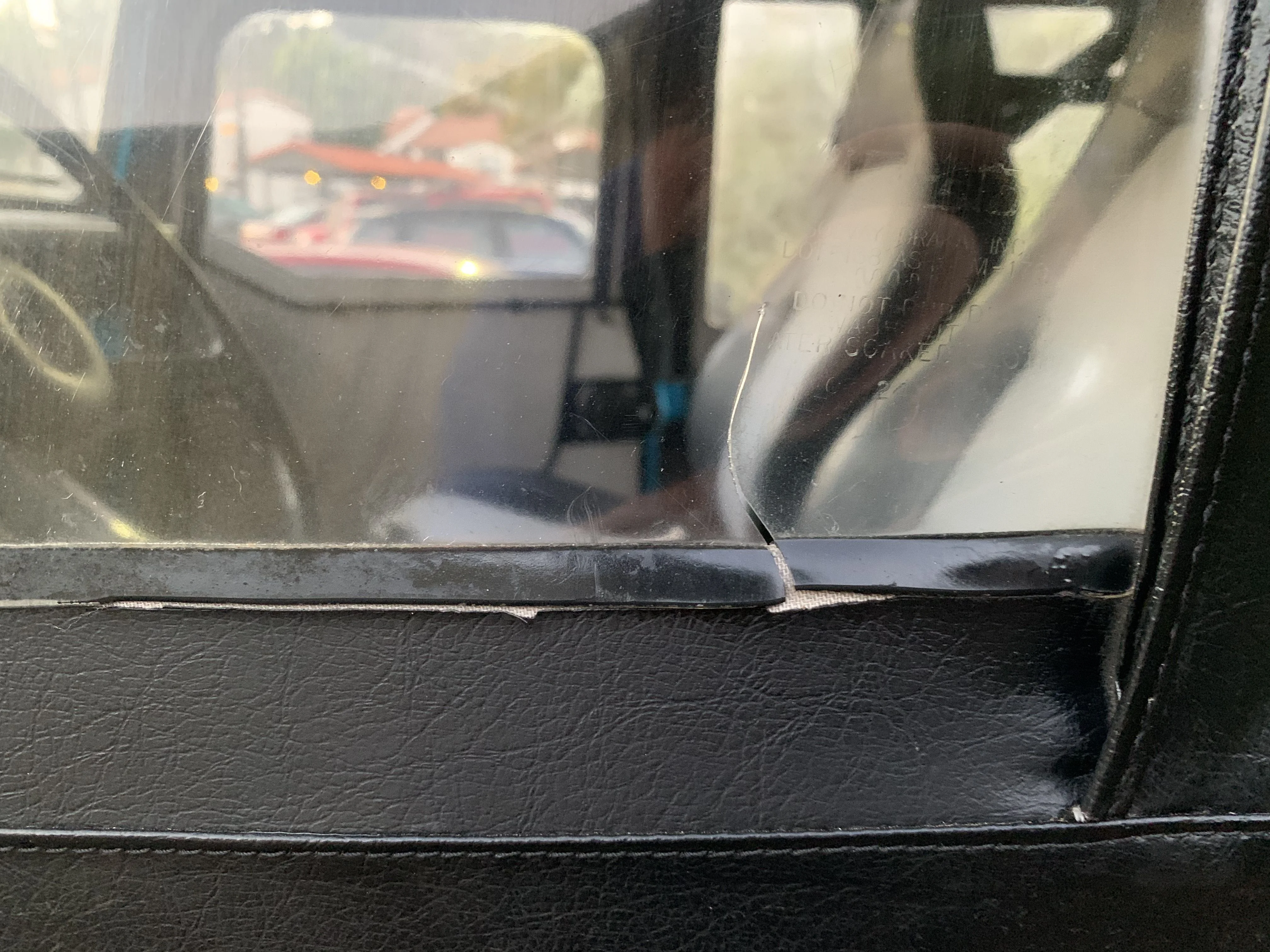 Driver Door window tear outside