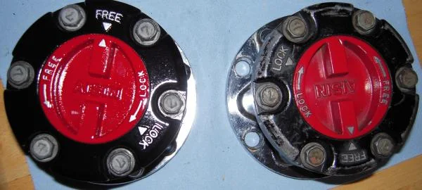 Found a set of IFS aisin hubs, installed the longfield hub gears to convert them to a soild axle hub and repainted the faces.  Before and after the paint