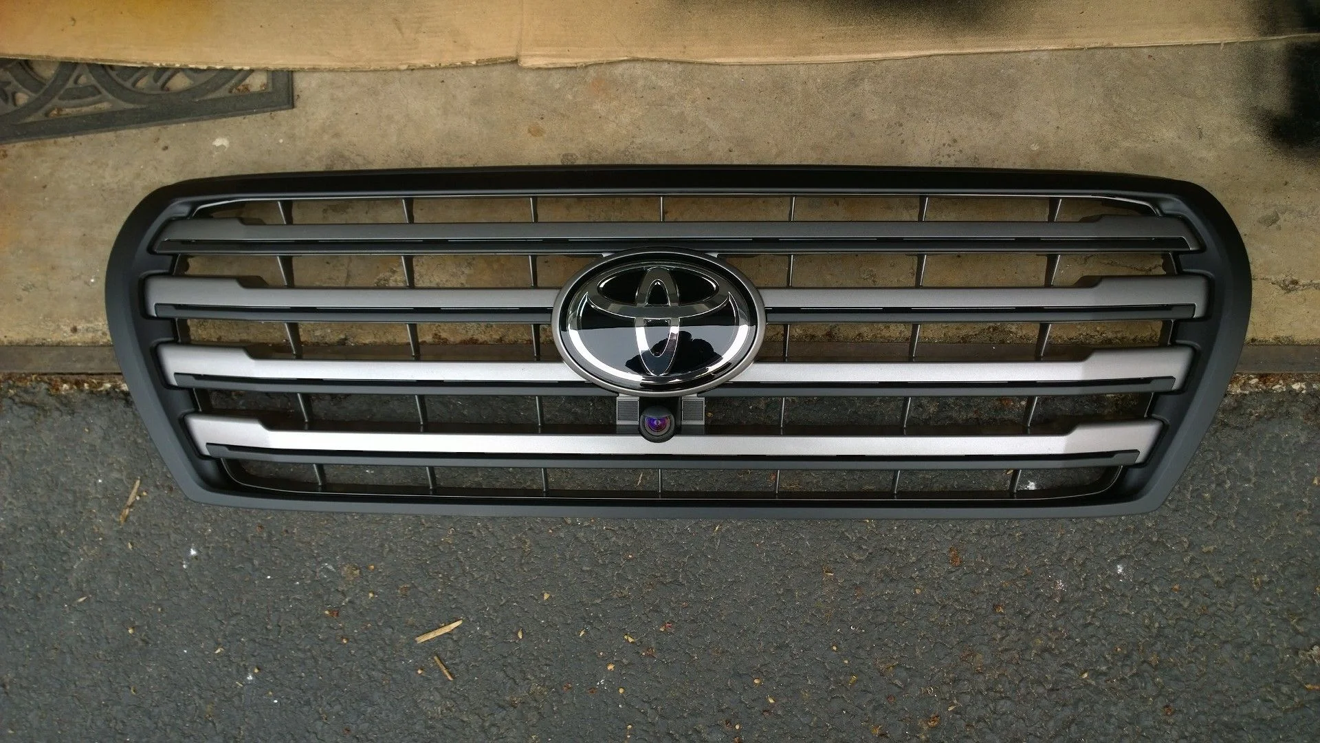 Grille with covered chrome