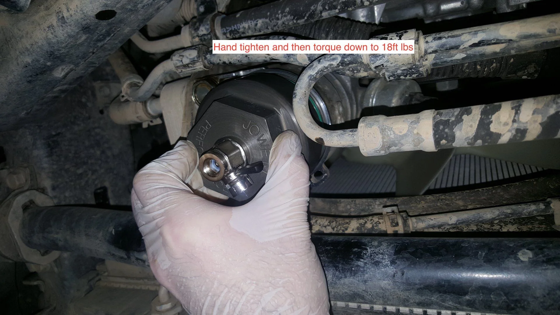 hand tighten oil filter cap