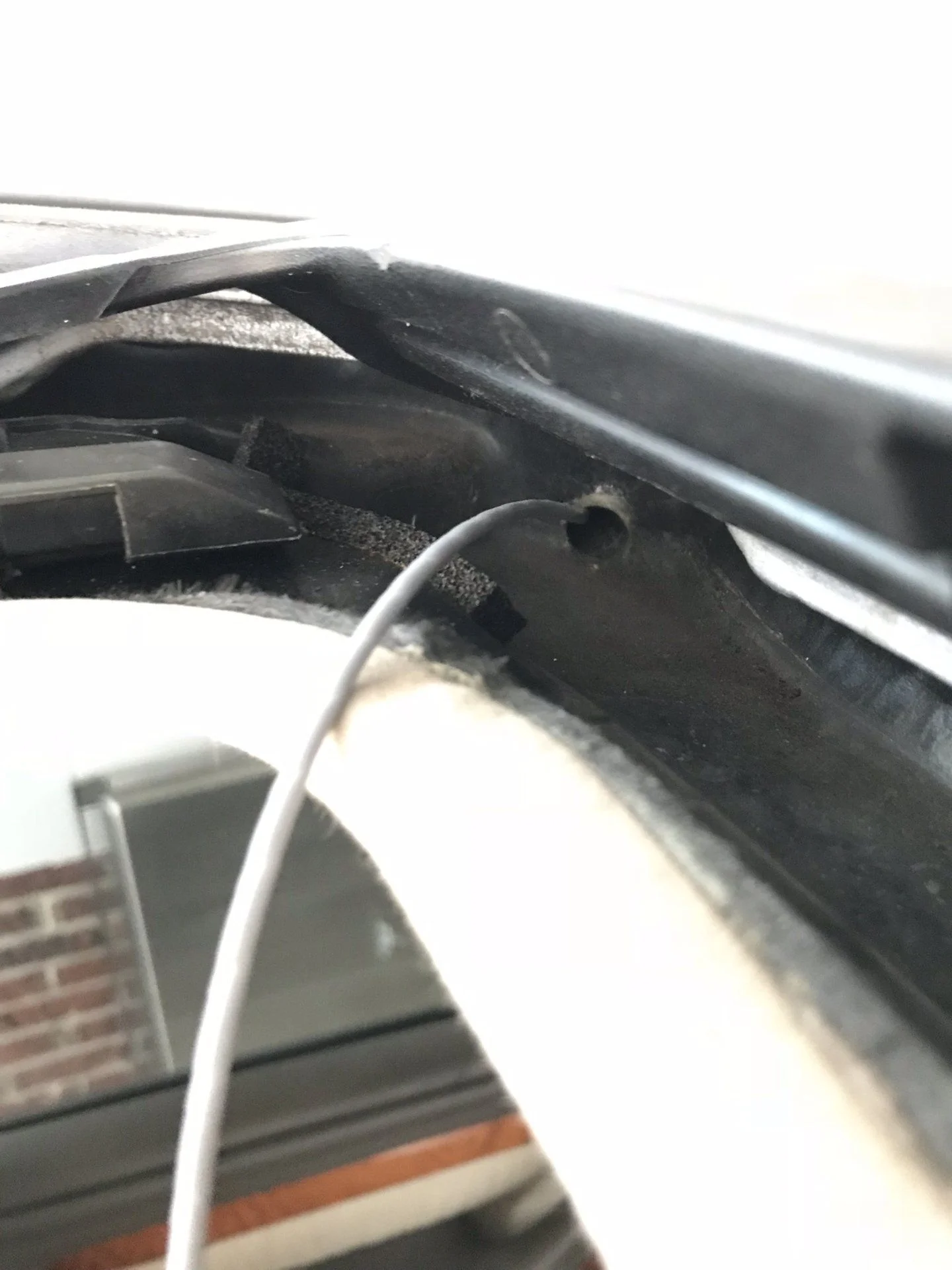 I noticed after washing my truck that the PS floorboard was wet, so I snaked the sunroof drains with weed whacker line.