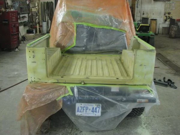 My new favorite guy sprayed her with etching primer as there was a fair bit of bare metal. Apparently not many people do this any more but it digs right in and gives an awesome prep surface for primer.