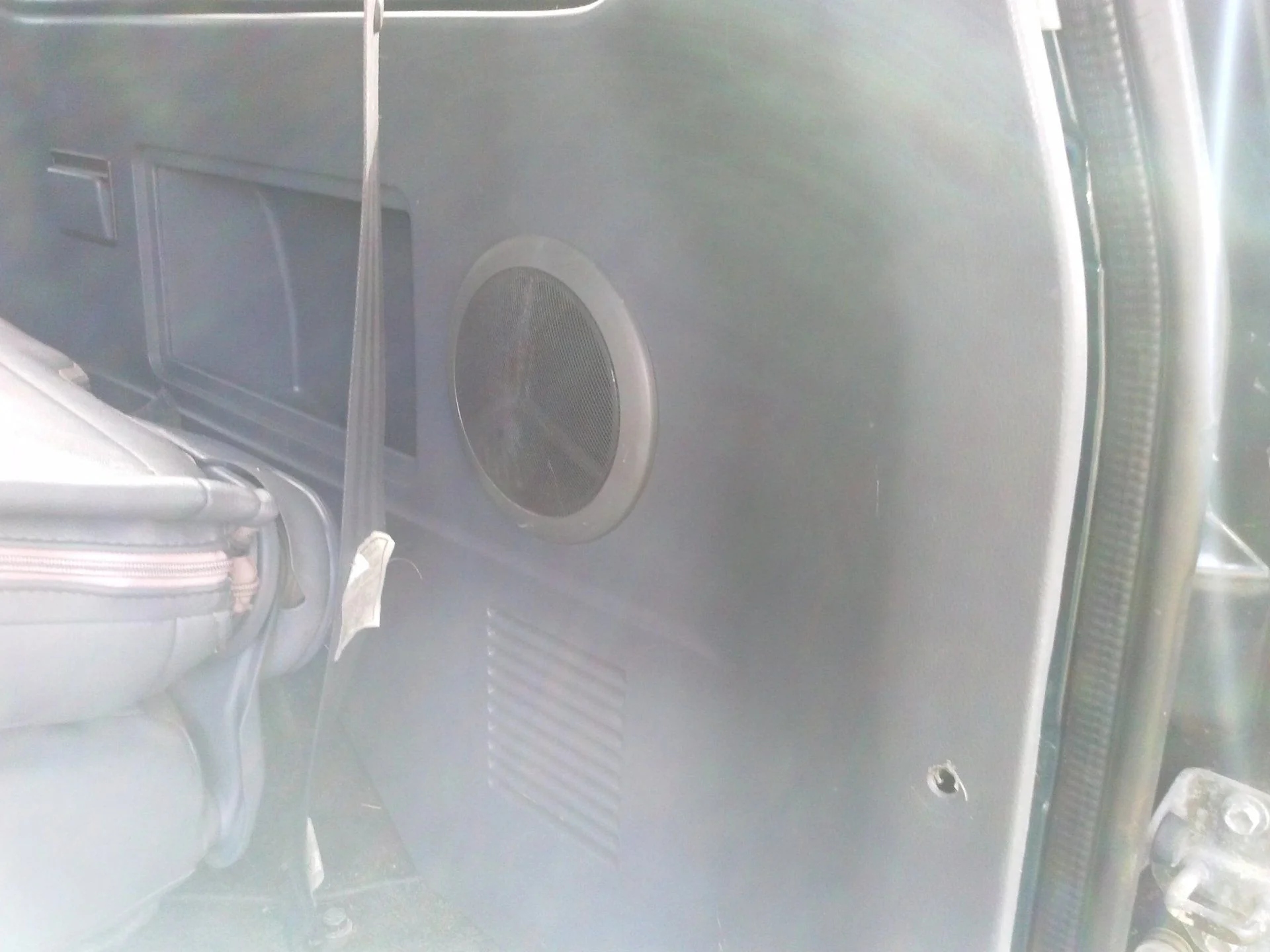 Passenger side cargo panel