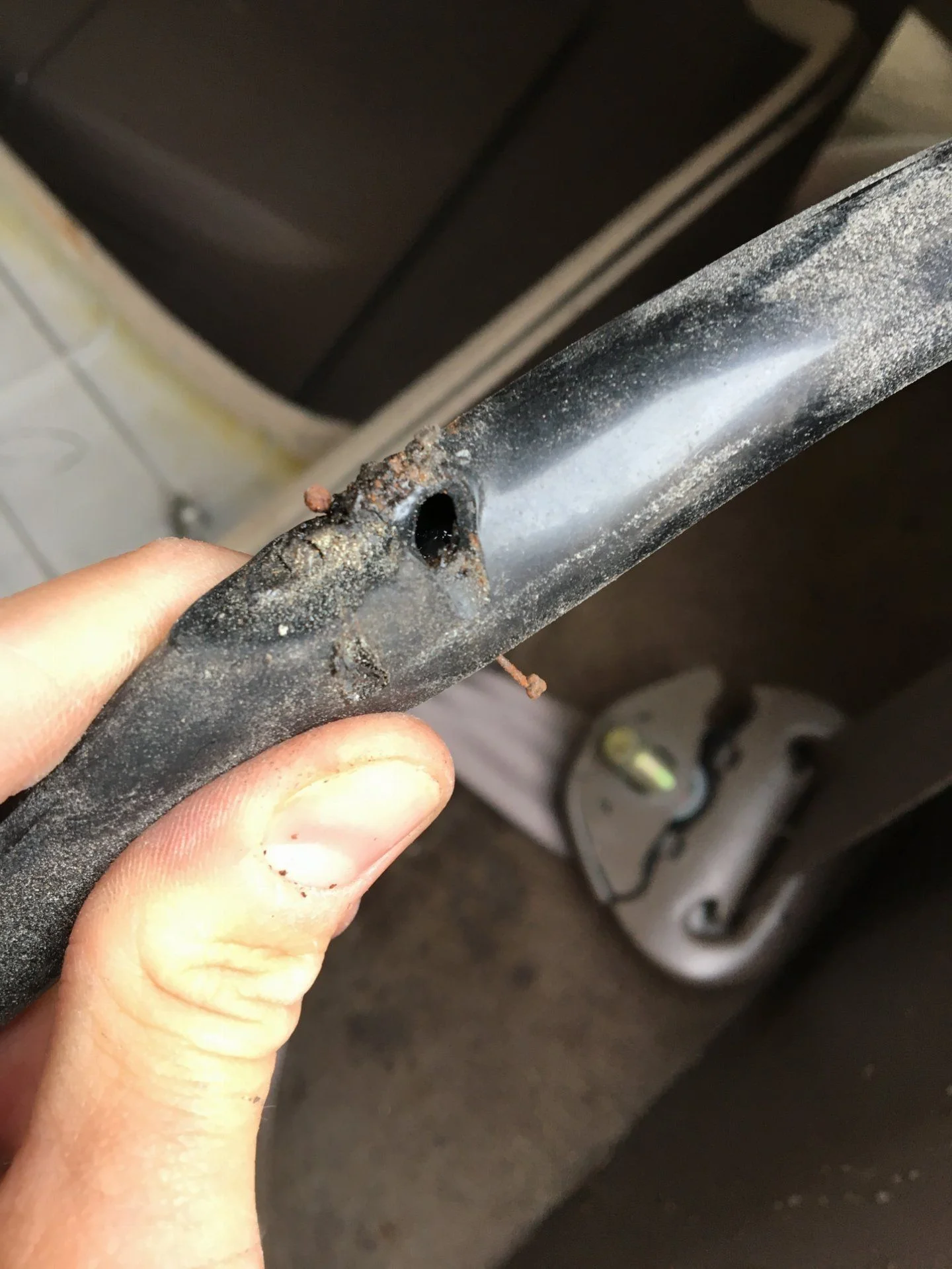 Puncture in driver side rear line