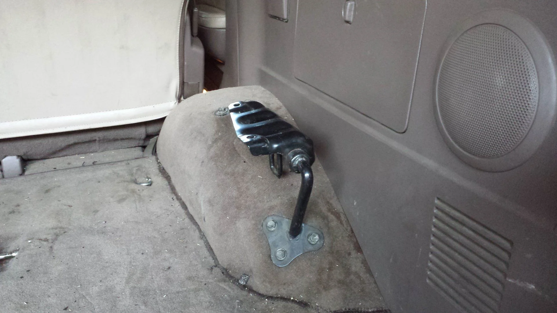 Rear seat removed from bracket