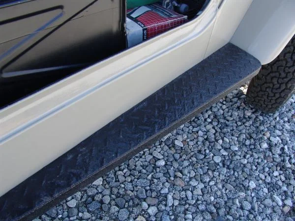 riveted aluminum diamond plate to original step but it was too bright.  sand blasted and coated with durabak.