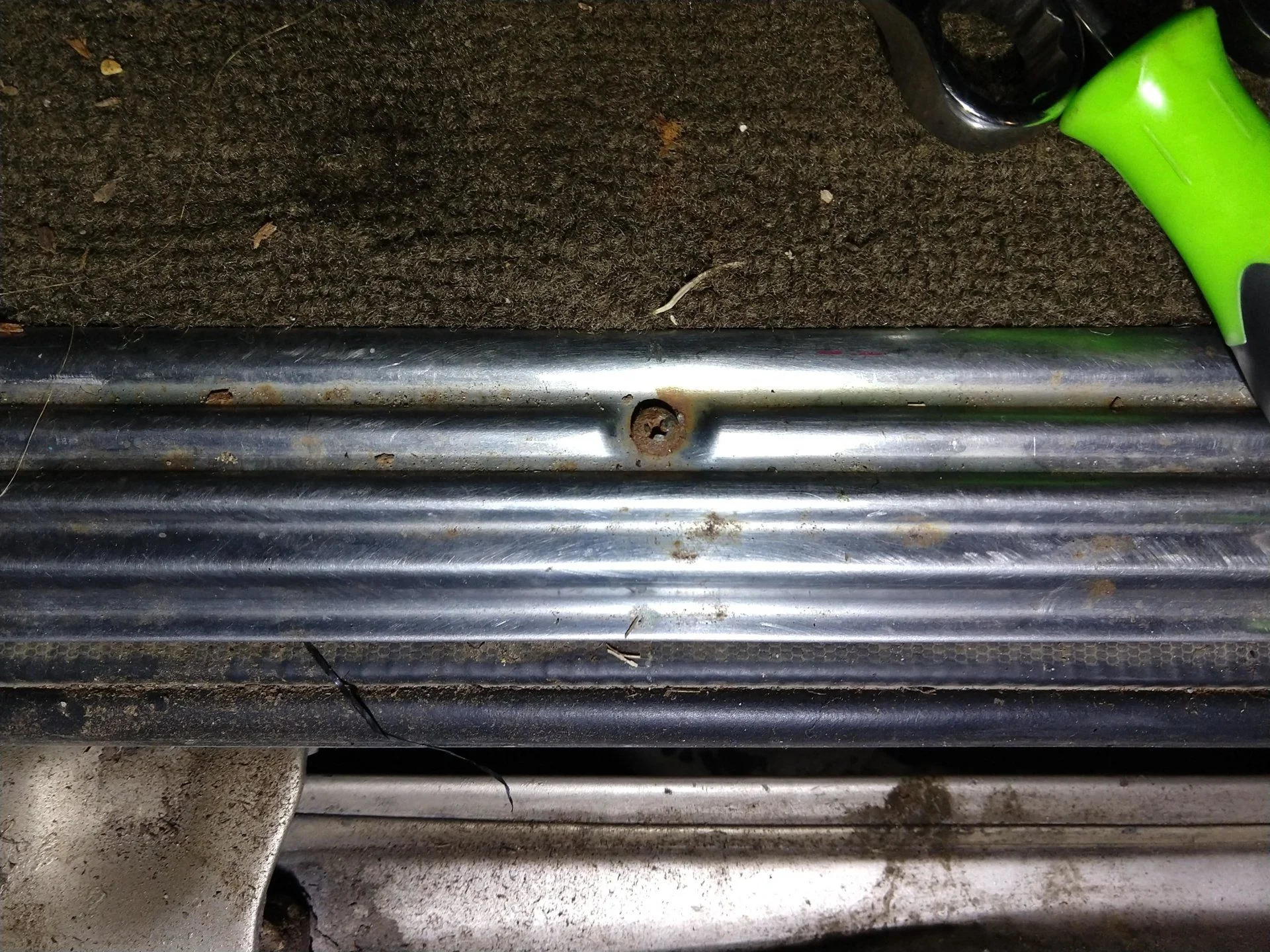 Rusted screws from rear cargo carpet stay