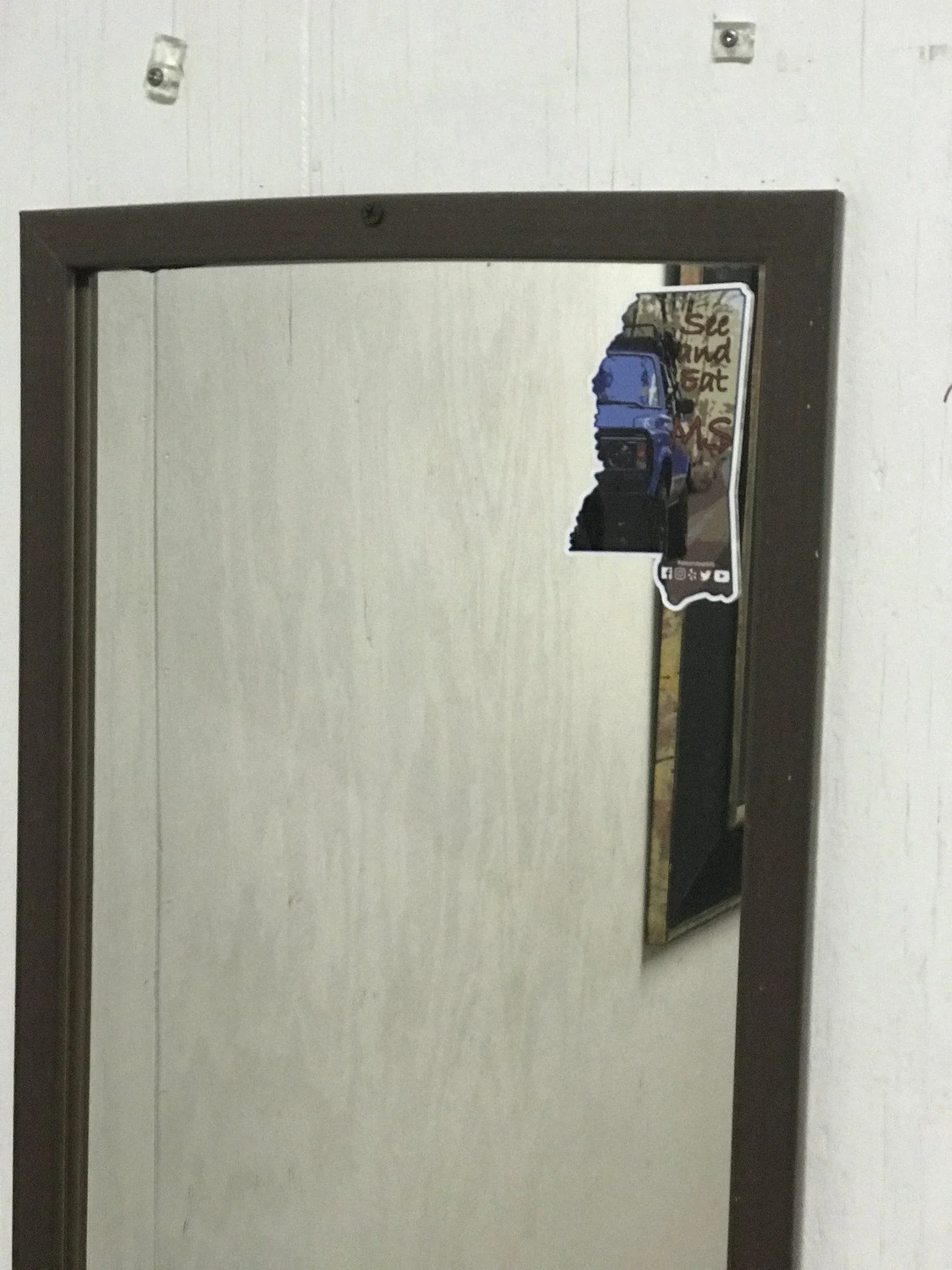 Someone tagged the mens room mirror at the Country Store in Lorman