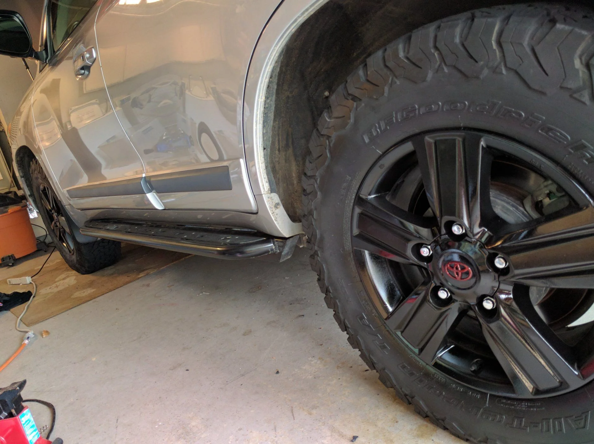 Stock wheels painted black red enameled logo
