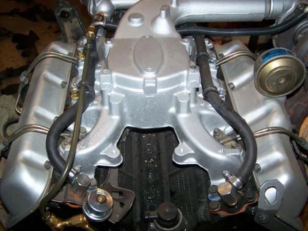 Summer 2009 >> One of the modifications I made was to improve cooling to the rear engine cylinders. Also, in the lower left, you can see the T, fabricated from brass plumbing fittings, for the oil pressure adapter and turbocharger.