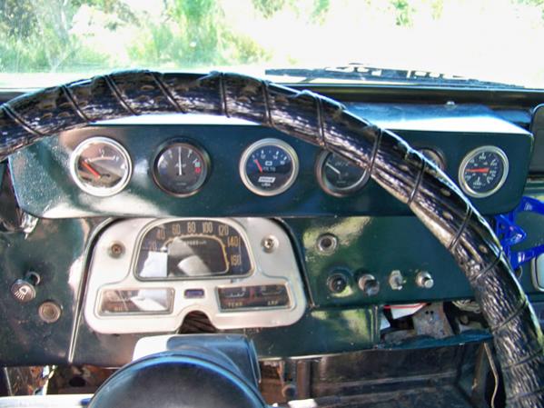 The gauge panel is customize but getto of course.  They all work... kinda.  The only thing that still works in the oem cluster is the hi-beam and turn signal indicators.  I don't really need a speedo the 3B won't get over 50MPH anyway.