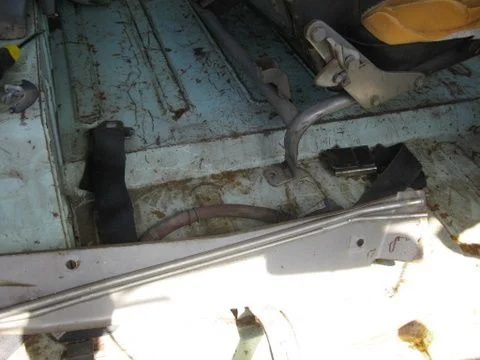 This is screwed to the bottom of the bench seat on pasanger side.