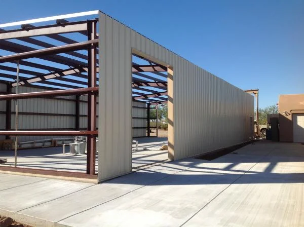 This is the North exposure with single bay door at east end and Man door at west end. This door will facilitate a two post lift and will be the only roll up door used.