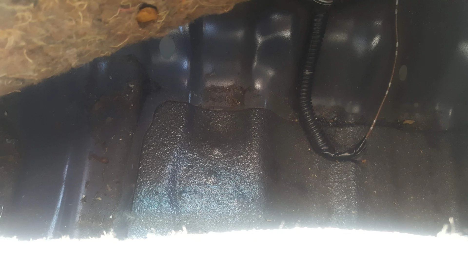Under Front Passenger Carpet