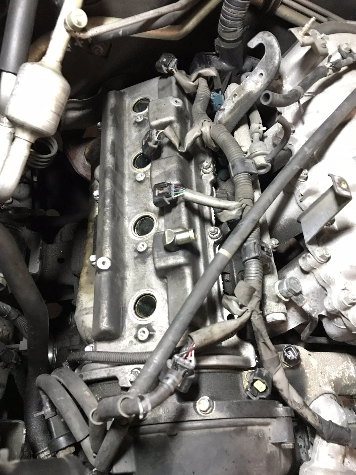 Valve covers back on! No leaks in 8,000 miles! I was really nervous I'd kinked a corner on the re-install - it's really hard to keep the gaskets in place as you put them back on.