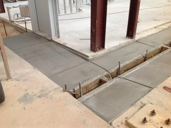 West end side walk and trench drain system poured. 5.5 yards.